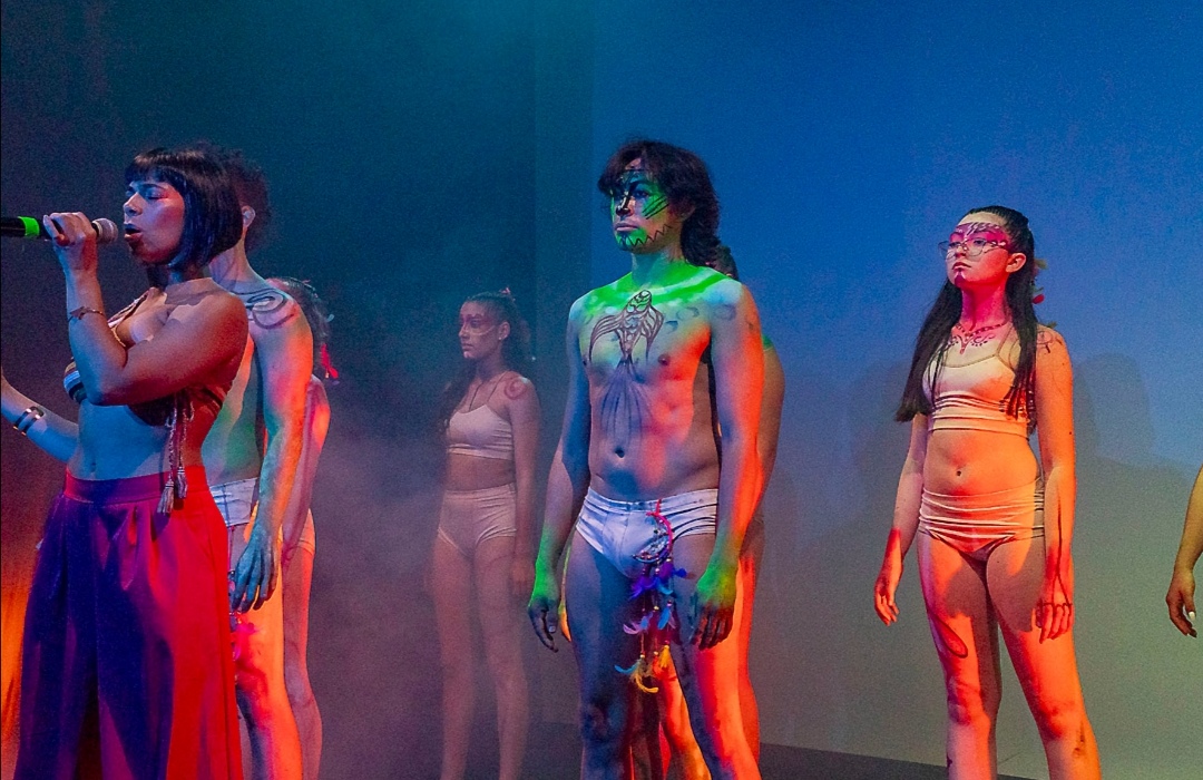 Ensemble performance with body paint under stage lights